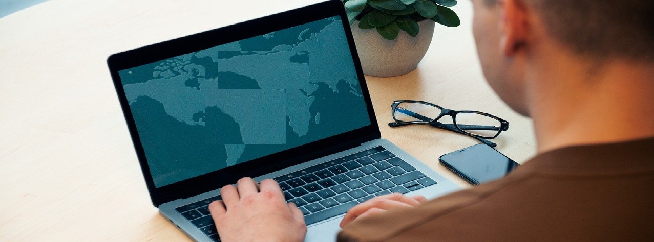 Stock image of a person sitting at a computer
