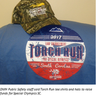 DMH Public Safety staff sold Torch Run tee shirts and hats to raise funds for Special Olympics SC